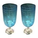 a pair of etched glass candlesticks