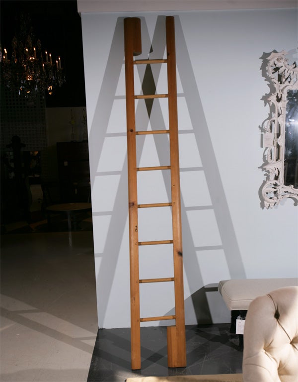Offered here is a unique pine pole ladder that collapses and folds into a pole.  14