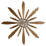 Carved and gilt "cloud" wall hanging starburst