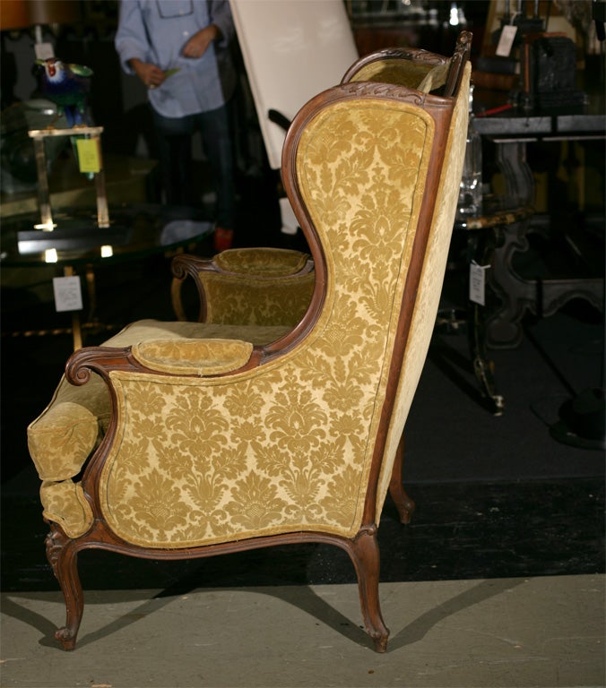 French carved wood wing chair 1