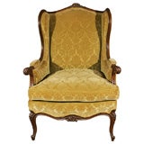 French carved wood wing chair
