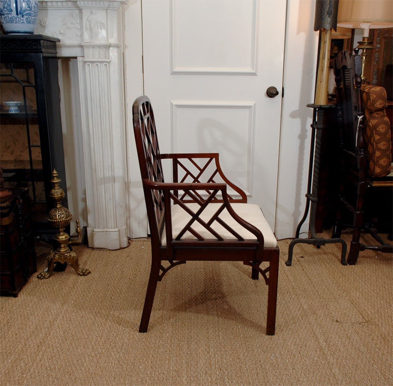 a late 18th century Chinese Chippendale arm chair, sometimes known as a cockpen chair