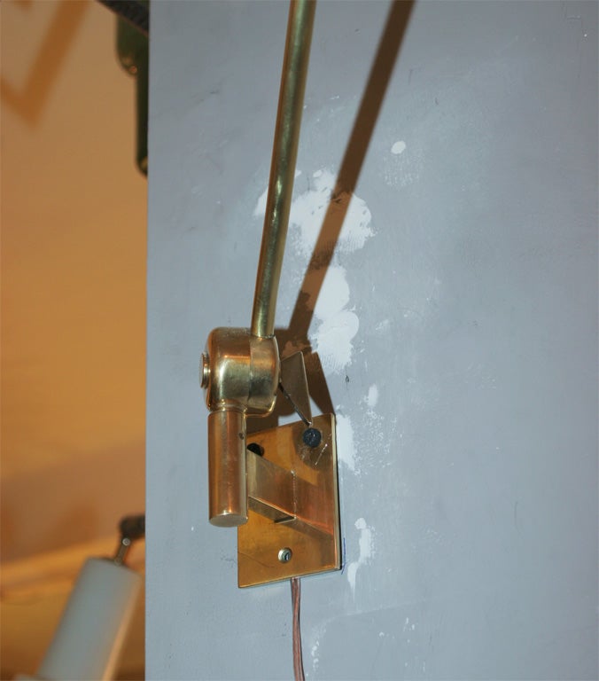 A Pair of Italian Articulated Wall Sconces signed Stilnovo