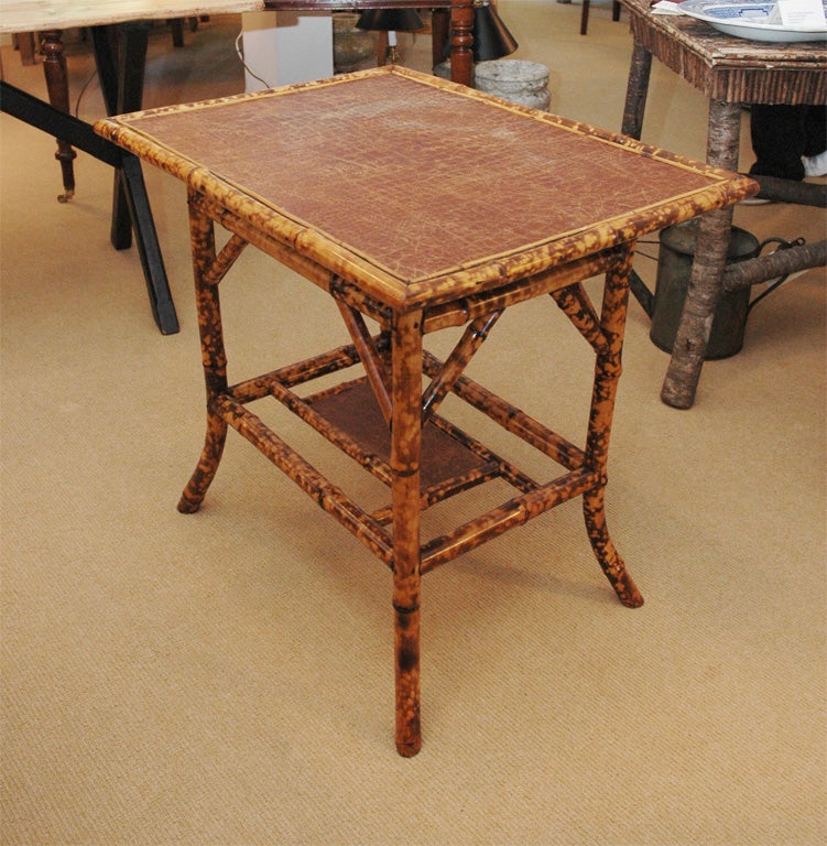 Perfectly restored Victorian Bamboo side table with a coffee-colored faux crocodile leather top.