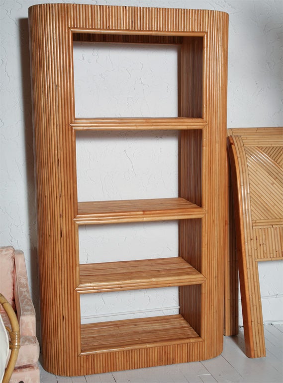 Rattan etagere with entire piece wrapped in rattan. Four shelves. ***Contact/Shipping Information: AOL (American Online) users may experience difficulties sending emails to us or receiving emails from us. If you have made an inquiry to us and have