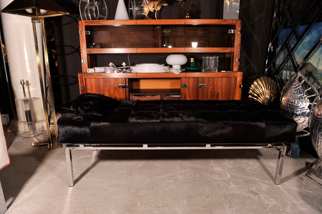use it as a daybed, use it as a bench, will add that extra seating anywhere. great comfort and sleek and sexy design. overdyed black cowhide and leather details. really a nice accent piece for any room.
