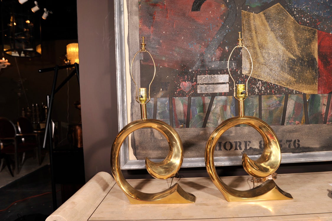 a truly fantastic pair of brass table lamps in the form of the Pierre Cardin logo, or just a lovely golden swirl. Often attributed to Pierre Cardin Home Collection, a very high quality lamp. the conditon is fantastic, with just a bit of age related