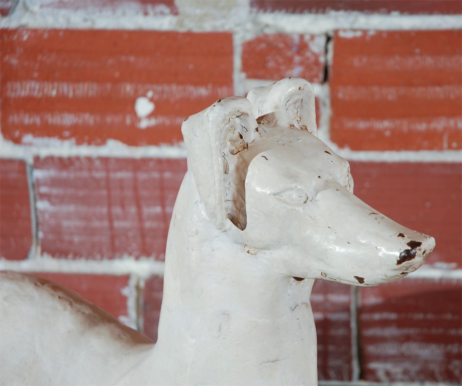 J.W. Fiske foundry attributed cast iron Whippet dog. Incredible white paint surface with many different layers of white paint.