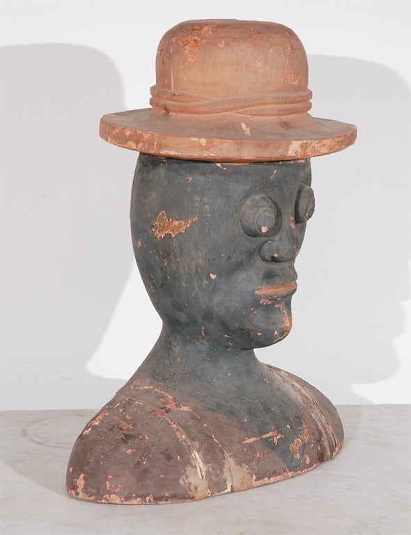 Nicely carved form of an African American Gentleman--likely a sharecropper.  Simple, yet very well executed carving.  The shoulders were carved and put together in pieces.  It almost looks like the carving on the shoulders was intended to be straps