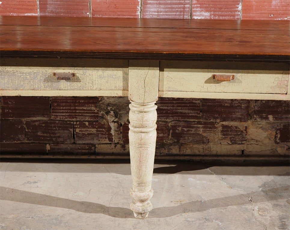 Fantastic American general store table found in the midwest.  Huge amount of storage in six drawers.  Desirable six leg construction with chunky turned legs.  Drawers appear to have been signed and numbered by the maker.