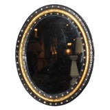 Ebonized and Gilded Irish Oval Mirror