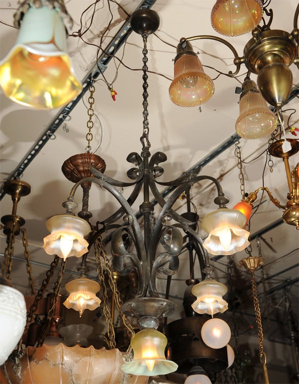 A graceful, sinewy European chandelier with beautiful period vaseline glass shades.<br />
Can be shortened or lengthened to  your liking.