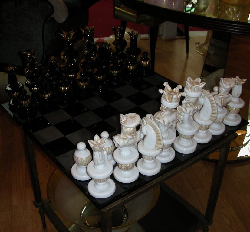 1980s Murano glass chess game. Size of chess board 55 x 54.5 cm. Size of pawns: height 9 cm., diameter 6 cm. Dimensions below are for the largest piece, the King.