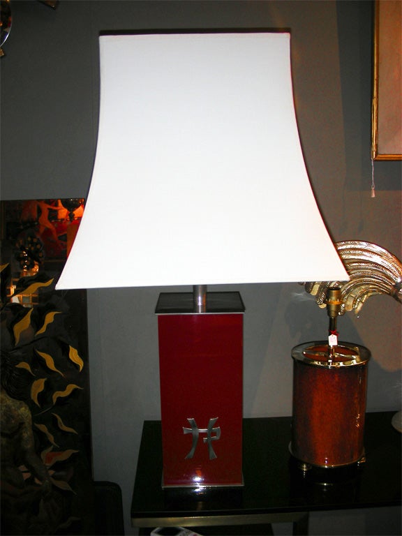 Two 1970s red lacquer lamps by the decorator Jean-Claude Mahey, with a Chinese ideogram decoration on one side. One light, new shades.