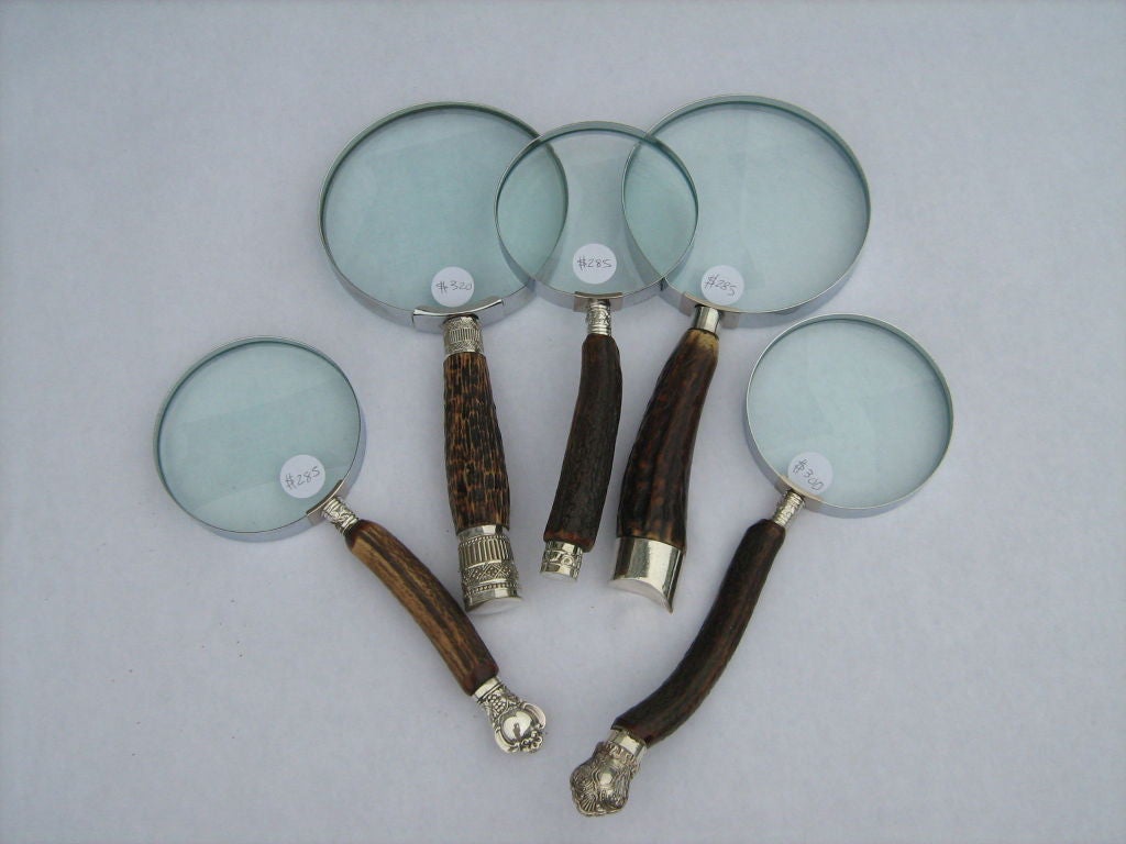 Variety of hand held magnifying glasses from both the US and England. Most are antique with interesting detailed handles. Prices range from $ 75.00 to $ 285.00.(BRASS,EBONY SOLD)