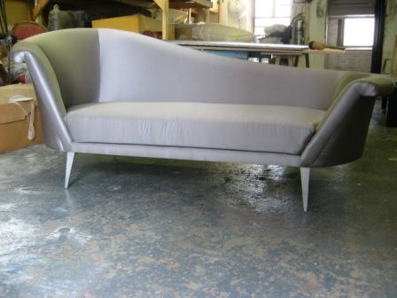 1930's style chaise. High style glamorous chaise in ice blue Satin and brushed aluminum legs.