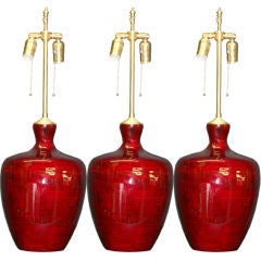 A pair of Red Lacquer vases with lamp application.