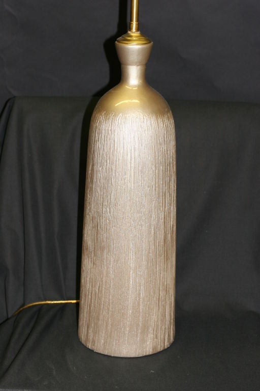 French A pair of Champagne Textured Ceramic vessels with lamp application