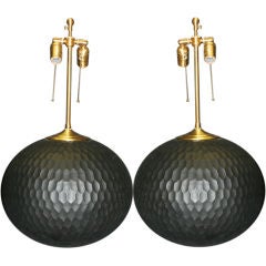 Pair of charcoal chiseled  wood orbs with  lamps application.