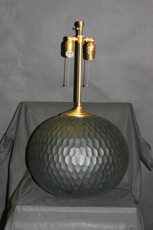 Pair of charcoal chiseled  wood orbs with  lamps application.