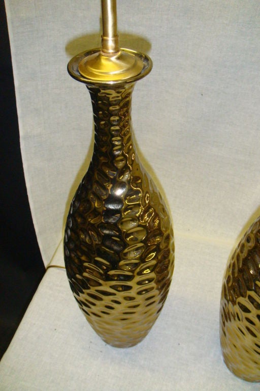 Pair of 1970's Glamorous gold metallic gouged ceramic lamps. For Sale 1