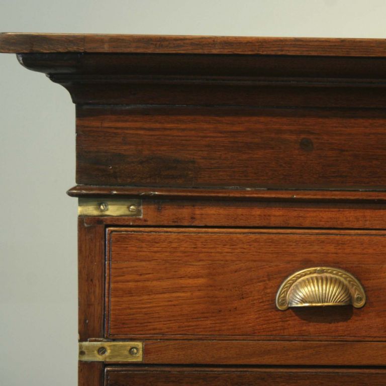 British colonial map chest made of solid teak with brass corner braces and brass finger pulls. Can be used as a chest of drawers.