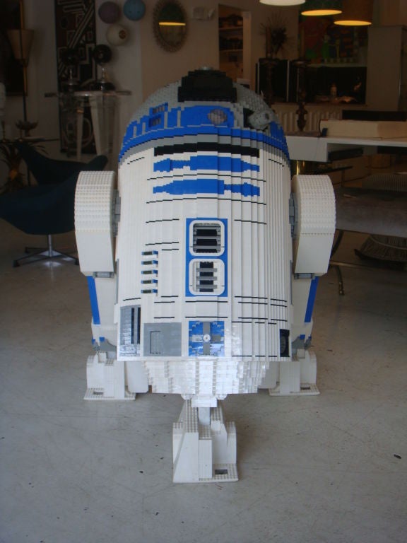 This is an incredible piece of art. It is a figure (R2D2) which has been constructed from thousands of Lego pieces. The detail is amazing. The color combinations and patterened design along with the shapes almost makes this hard to duplicate and