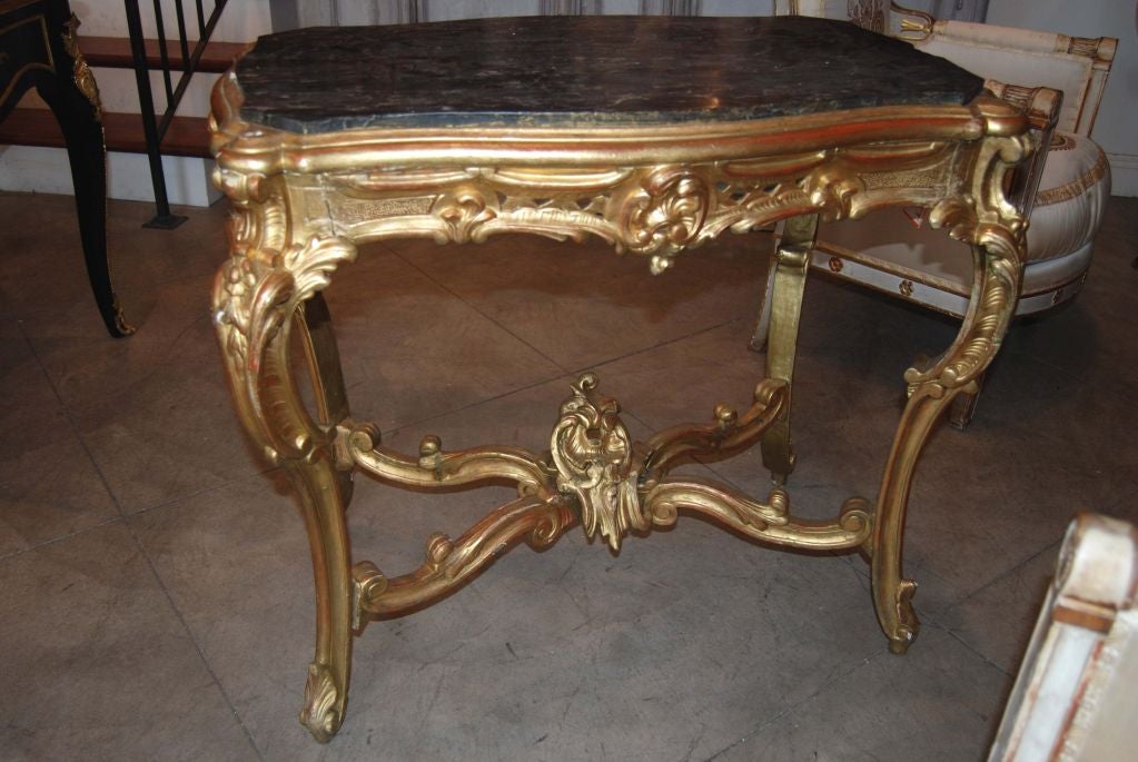 Carved abd Gilded Center Table with Marble Top