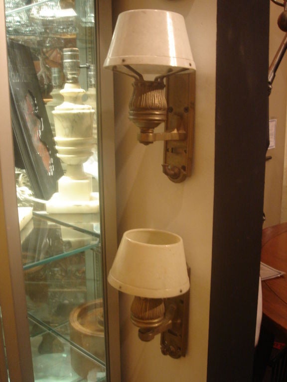 Vintage pair of brass sconces with Bakelite shades originally made for a Pullman passenger railroad car.