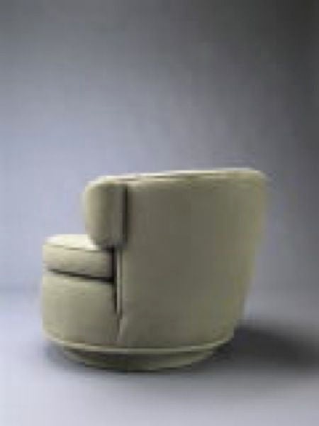 American PAIR OF AMERICAN 1940'S SWIVEL LOUNGE CHAIRS  manner James Mont For Sale