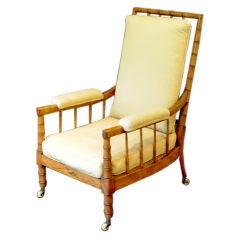 ENGLISH GEORGE III FAUX BAMBOO AND CANED ARMCHAIR