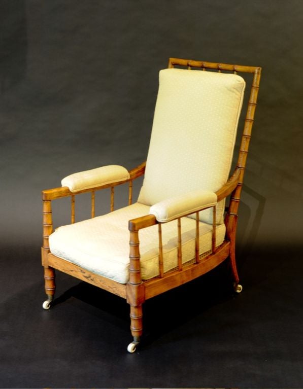 ENGLISH GEORGE III FAUX BAMBOO AND CANED ARMCHAIR