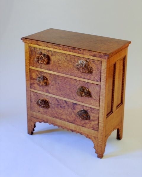 A SCANDINAVIAN BURL-WOOD AND FIDDLE-GRAINED  CHEST OF DRAWERS