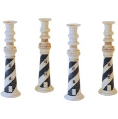 A SET OF FOUR ANGLO-INDIAN CARVED BONE LIGHTHOUSE CANDLESTICKS