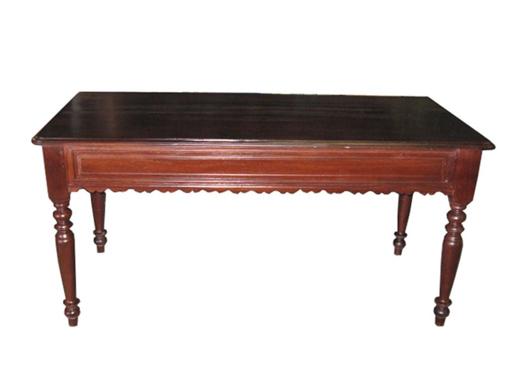 Vietnamese Art Deco one drawer mahogany wood entry table. With turned legs and scalloped edge apron.