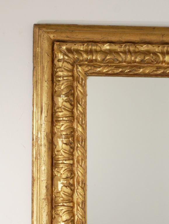 A great looking and large mid-19th century Italian Baroque giltwood mirror. Originally a painting frame. From the collection of a noted West Coast antiques dealer.