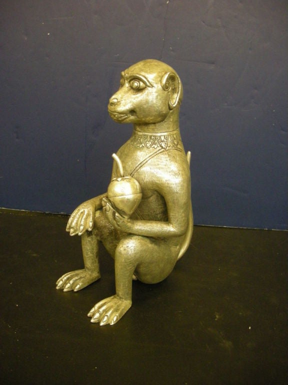 Sterling silver seated monkey holding a pomegranate; The head and fruit are both removable; Box is hand made in Cambodia.