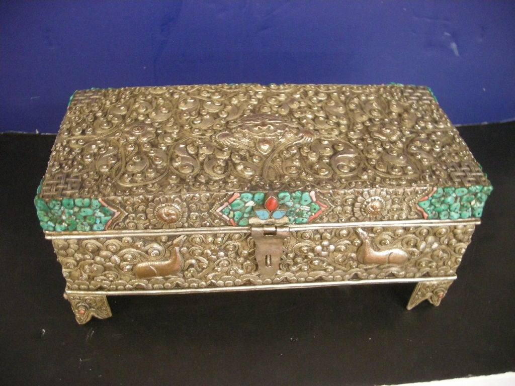 Very rare silver-over-copper repoussé Tibetan box with hand set turquoise and red coral clusters