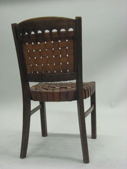 An early German modernist desk chair with seat and back rest composed of intersecting layers of leather straps.

This chair is original but can be reproduced to meet your specifications as a set of dining chairs.