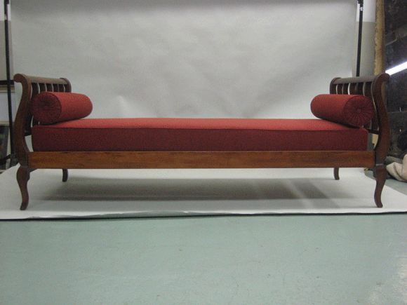 Exceptional French daybed in the modern neoclassical spirit with captivating lines and form; attributed to Jean Maurice Rothschild. Can be used as a sofa or single bed. Upholstery is new but can easily be changed to suit taste.