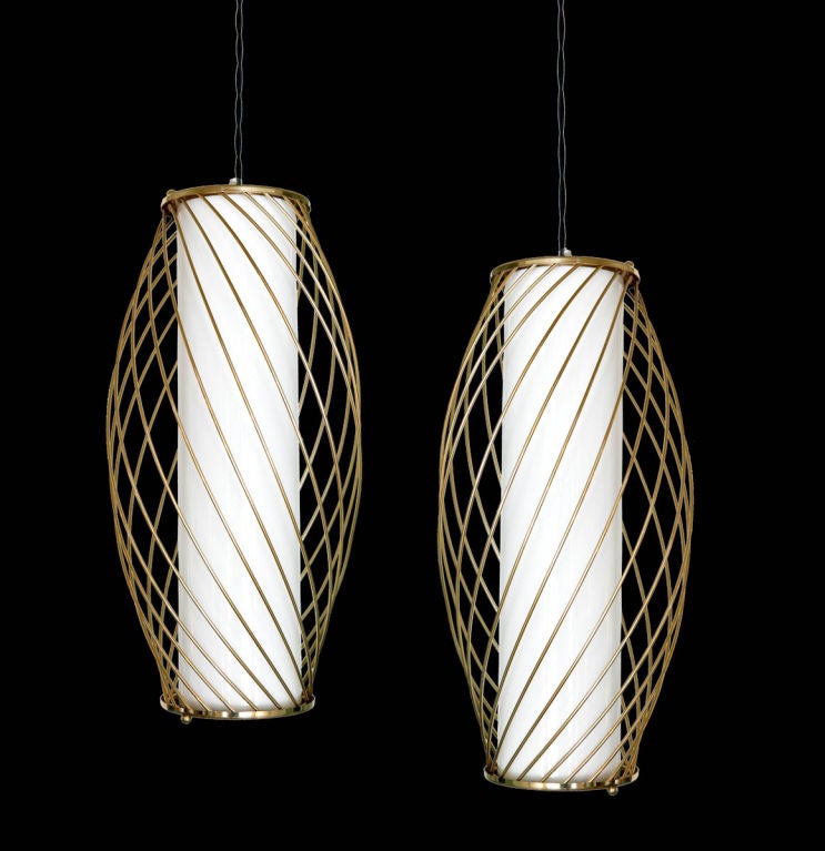 Pendant with brass plated spiral details and milk glass diffuser.