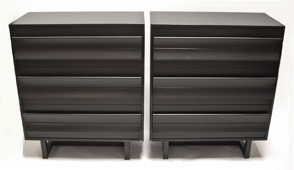 Pair of six drawer dressers designed by Paul Laszlo for Brown Saltman. Very dark, almost black lacquered finish. Signed.