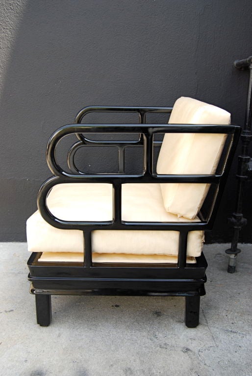 This is a supurb and rare example of Frankl's work!  It is finished in black lacquer with micro ribbed silk cushions.