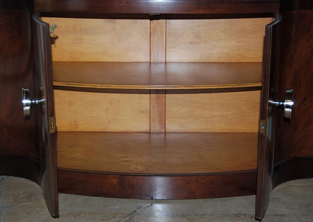 A beautiful bookcase in flamed mahogany with polished nickel hardware.
Extremely elegant.
For Johnson Furniture Co. Branded and documented.