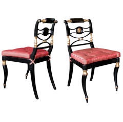 An Elegant Pair of English Regency Chairs with Caned Seats
