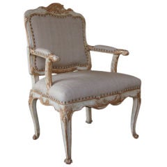 A Well-Carved French Rococo Pale Green Painted Armchair