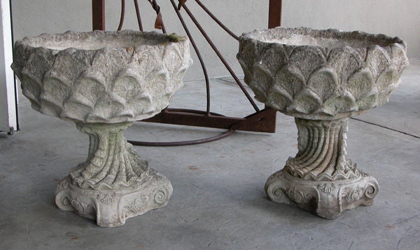 A large and unique pair of Italian cast stone garden urns in the 