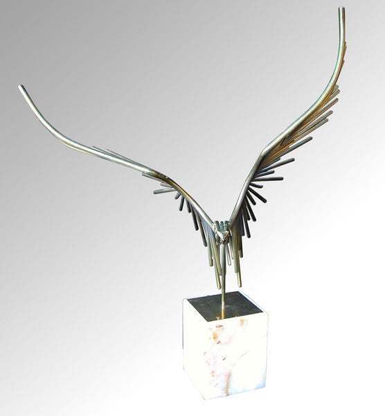 An abstract American bird of prey sculpture composed of brass rods; signed 
