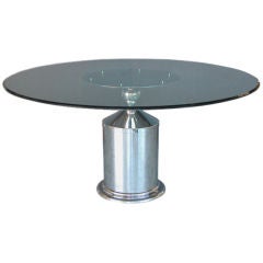 An American Stainless Steel  Circular Dining Table; J Wade Beam