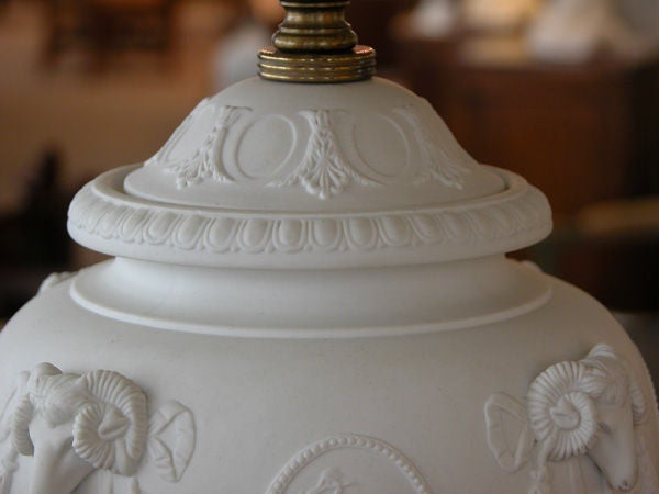 A fine pair of American 1940s Wedgwood style white bisque porcelain baluster-form lamps; labeled and stamped 